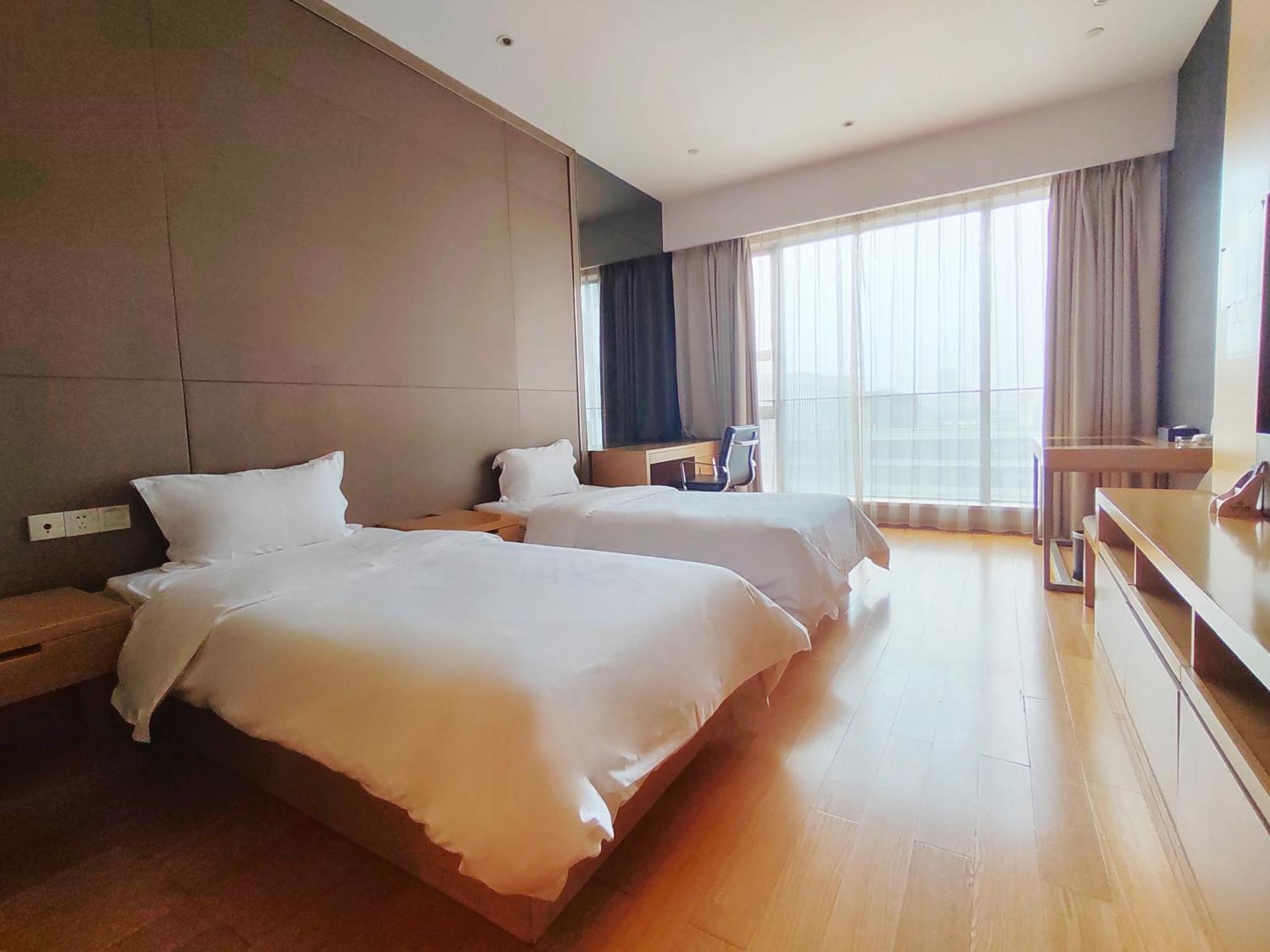 Snug Gaokong Jiangjing Aparthotel 3*